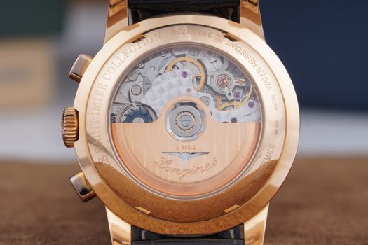 Exquisite close-up of a Swiss-made luxury watch showcasing intricate internal mechanics.