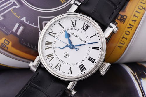 An Analog Watch With a Leather Strap