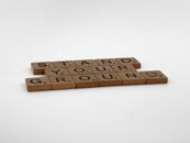 Scrabble Pieces on a White Surface