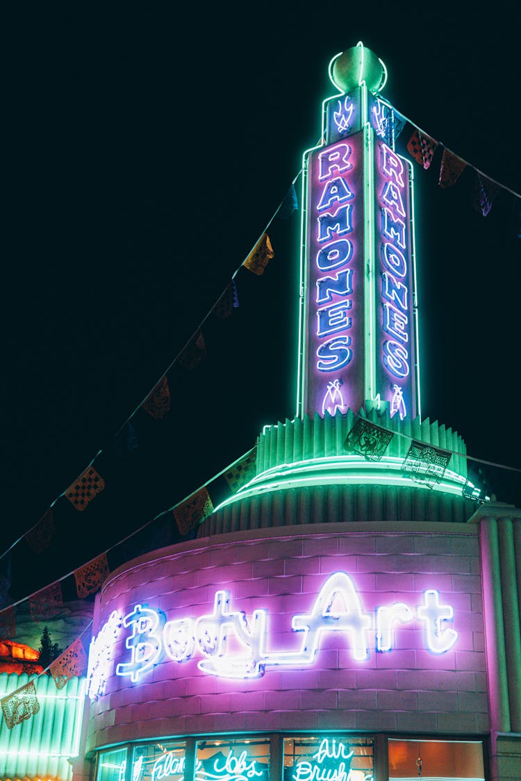 Low Angle Shot Of An Establishment With Neon Lights