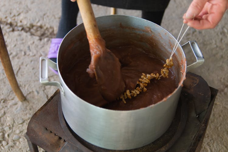 Brown Wooden Ladle In The Pot