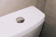A White Ceramic Toilet Bowl with Dual Flash