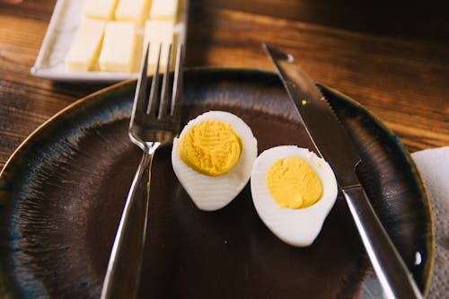 Sliced Egg on Black Plate