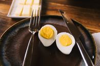 Sliced Egg on Black Plate