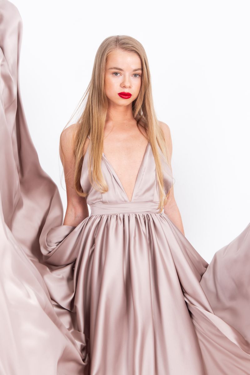 Woman in flowing evening gown, glamorous date night outfit