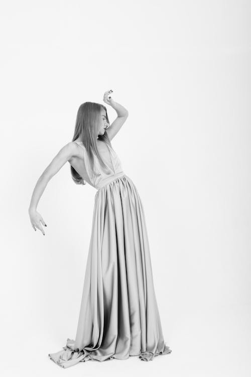 Monochrome Photo of Woman in a Long Dress
