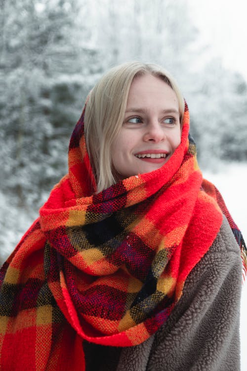 Free Woman in Red Scarf Standing Near Snow Covered Ground Stock Photo