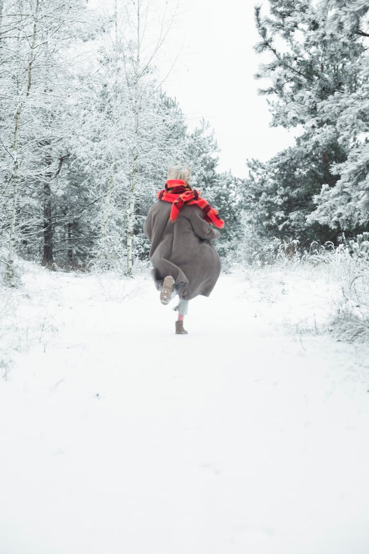 Person Running On Snow