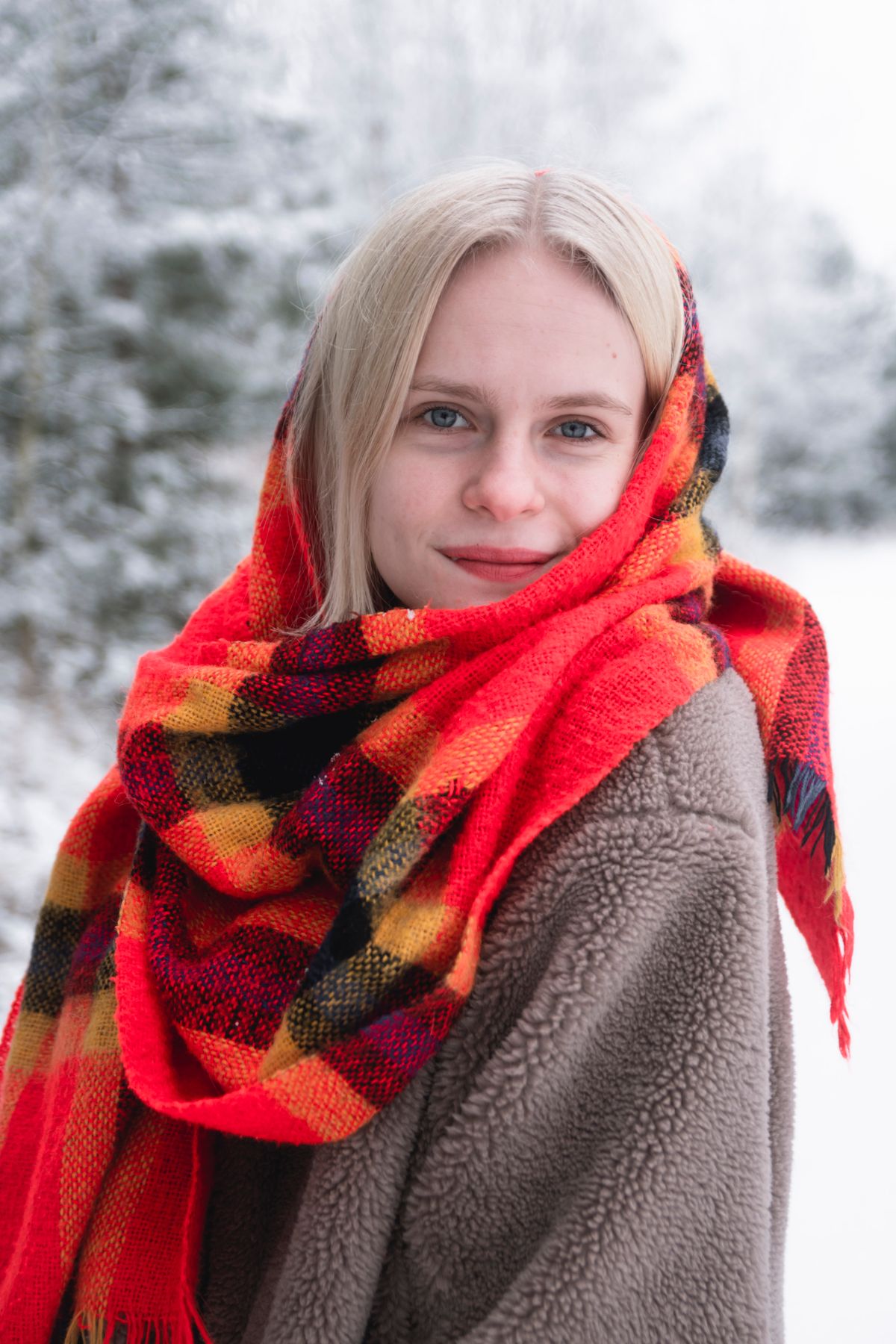 Red check supporter scarf worn outdoors
