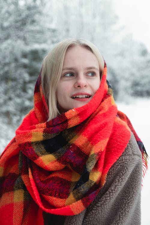 A Woman in Red and Orange Scarf