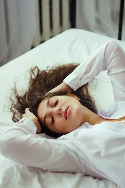 A Woman Resting in Her Bed