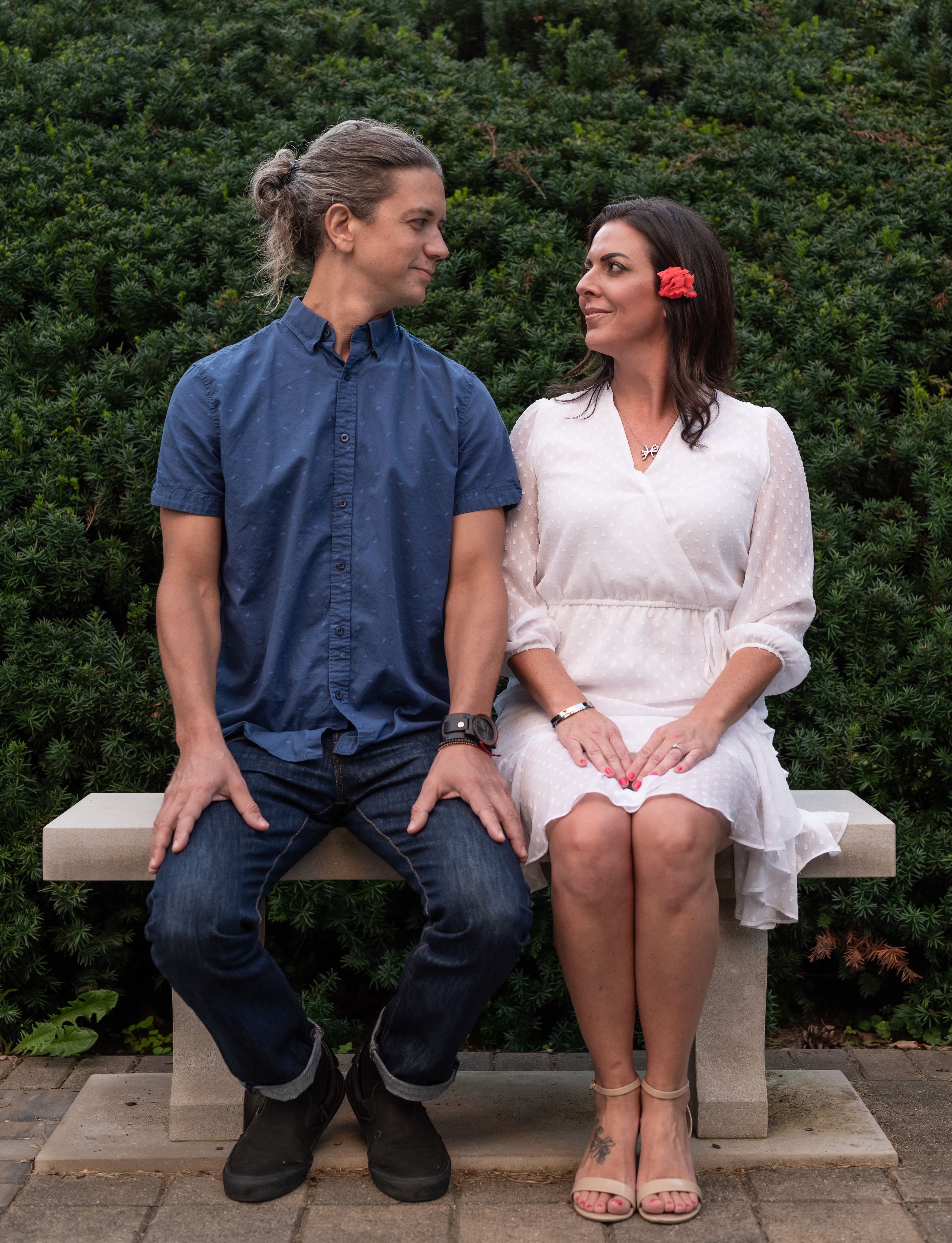 Man in Blue Shirt and Woman in White Dress Kissing · Free Stock Photo