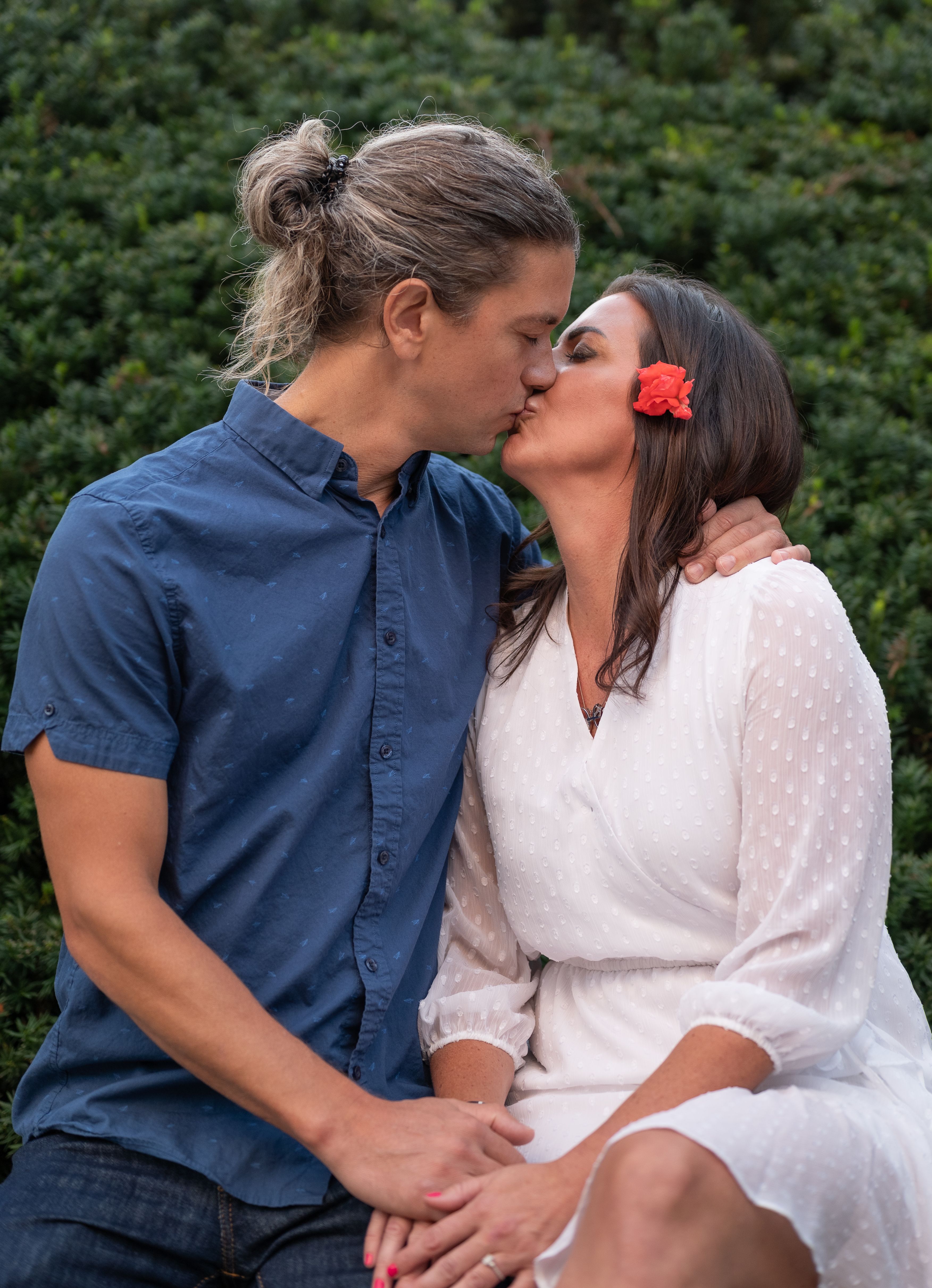 Man in Blue Shirt and Woman in White Dress Kissing · Free Stock Photo