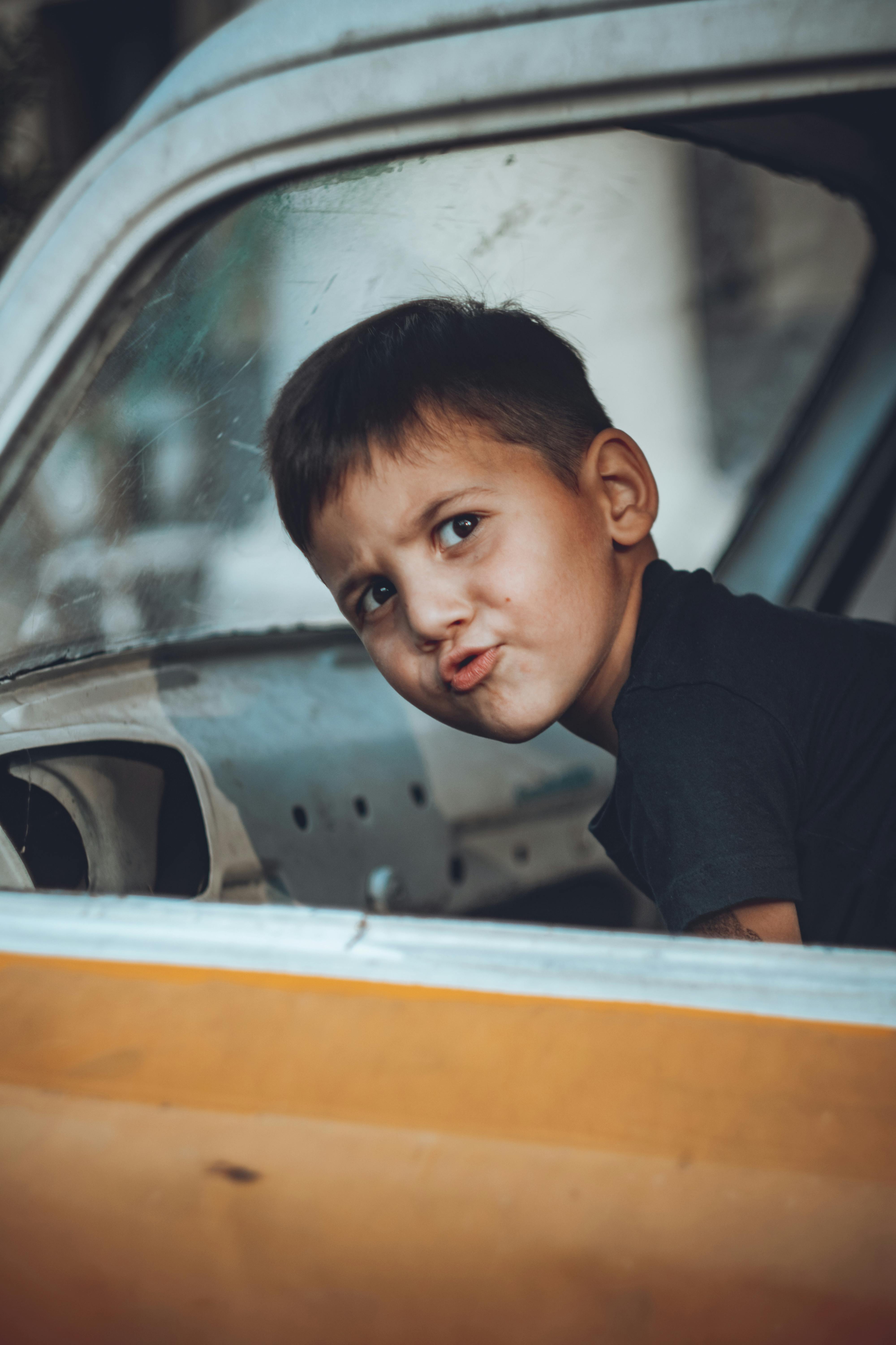 a boy looking at the camera