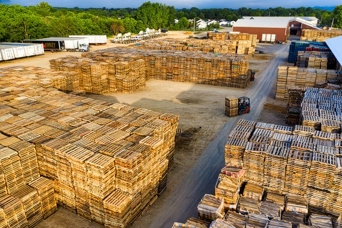 Wooden pallets stacked in a storage yard