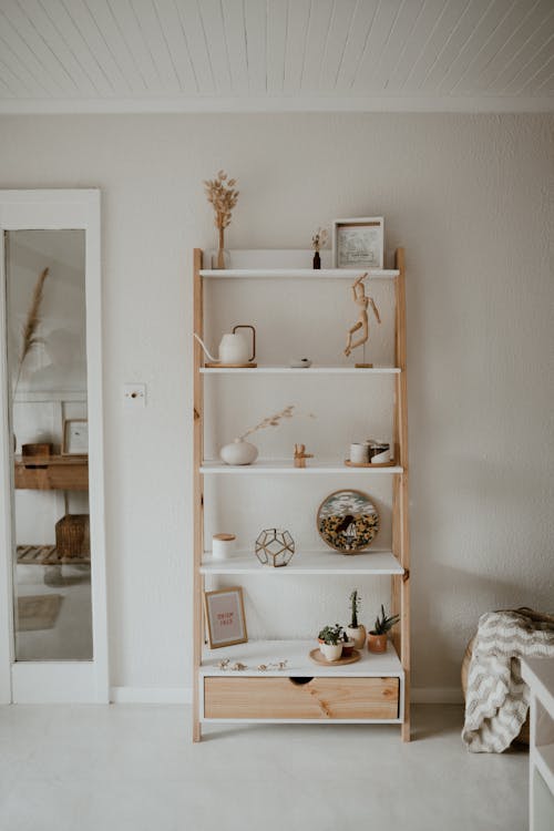 White Wooden Shelf with Home Decorations