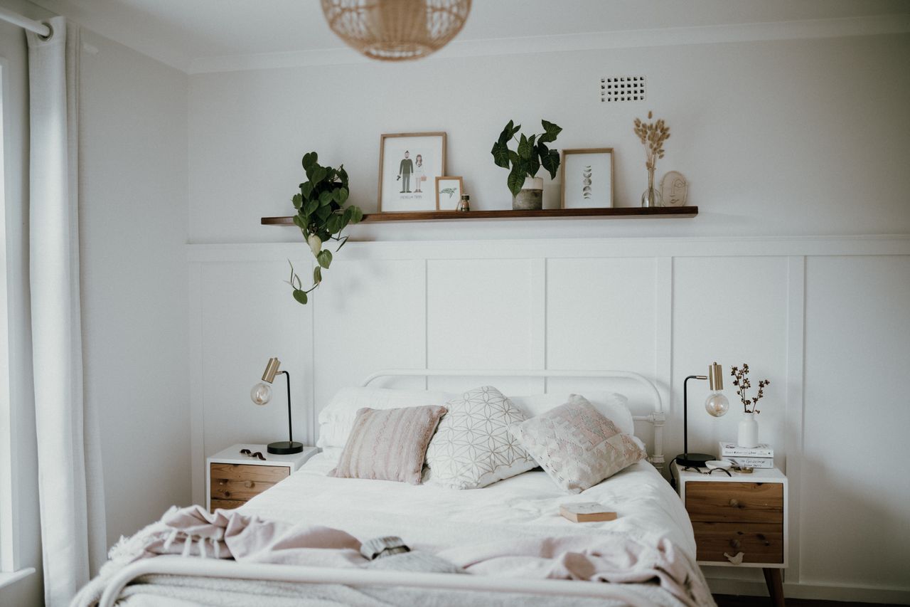 scandinavian-bedroom Scandinavian bedroom with minimalist decor and plants