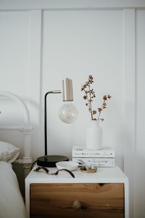 Free A White Ceramic Vase on the Bedside Table Stock Photo