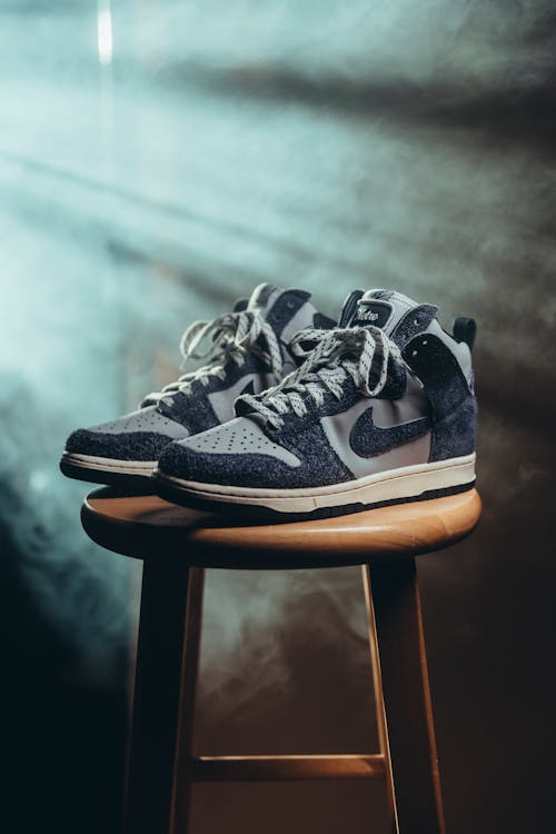 Pair of Nike Jordans on a Wooden Stool 