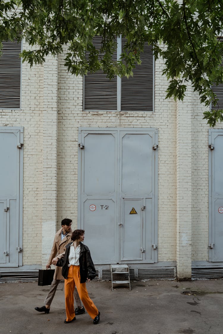 A Couple Walking On The Street