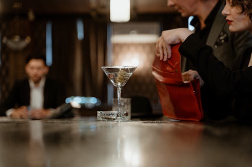 Martini Glass on the Wooden Bar Counter
