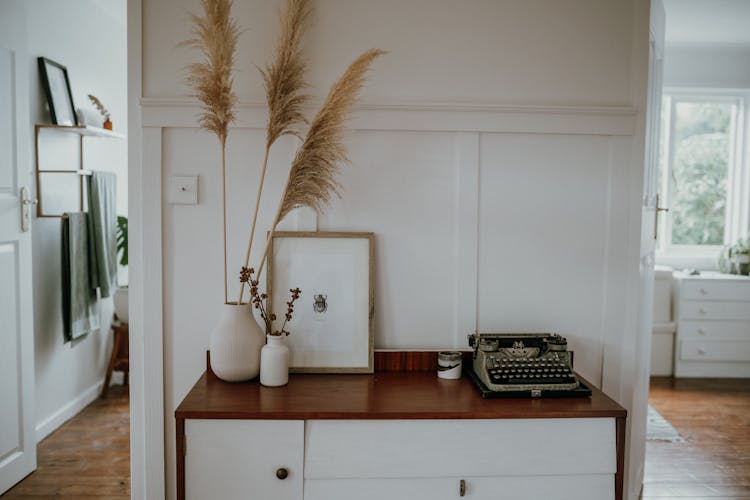 Home Decorations On Brown And White Wooden Table