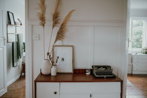 Free Elegant Scandinavian interior with pampas grass and vintage typewriter decor. Stock Photo