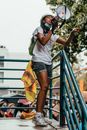 A Woman Standing on the Stairs Talking on a Megaphone