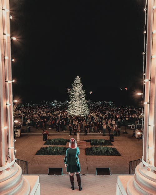 A Woman Standing in Front of the Crowd