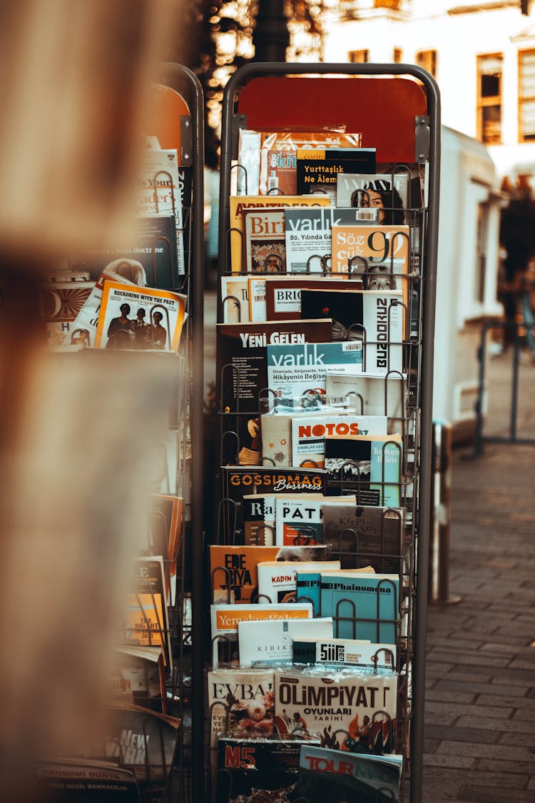 Magazines On A Stand In The Sidewalk