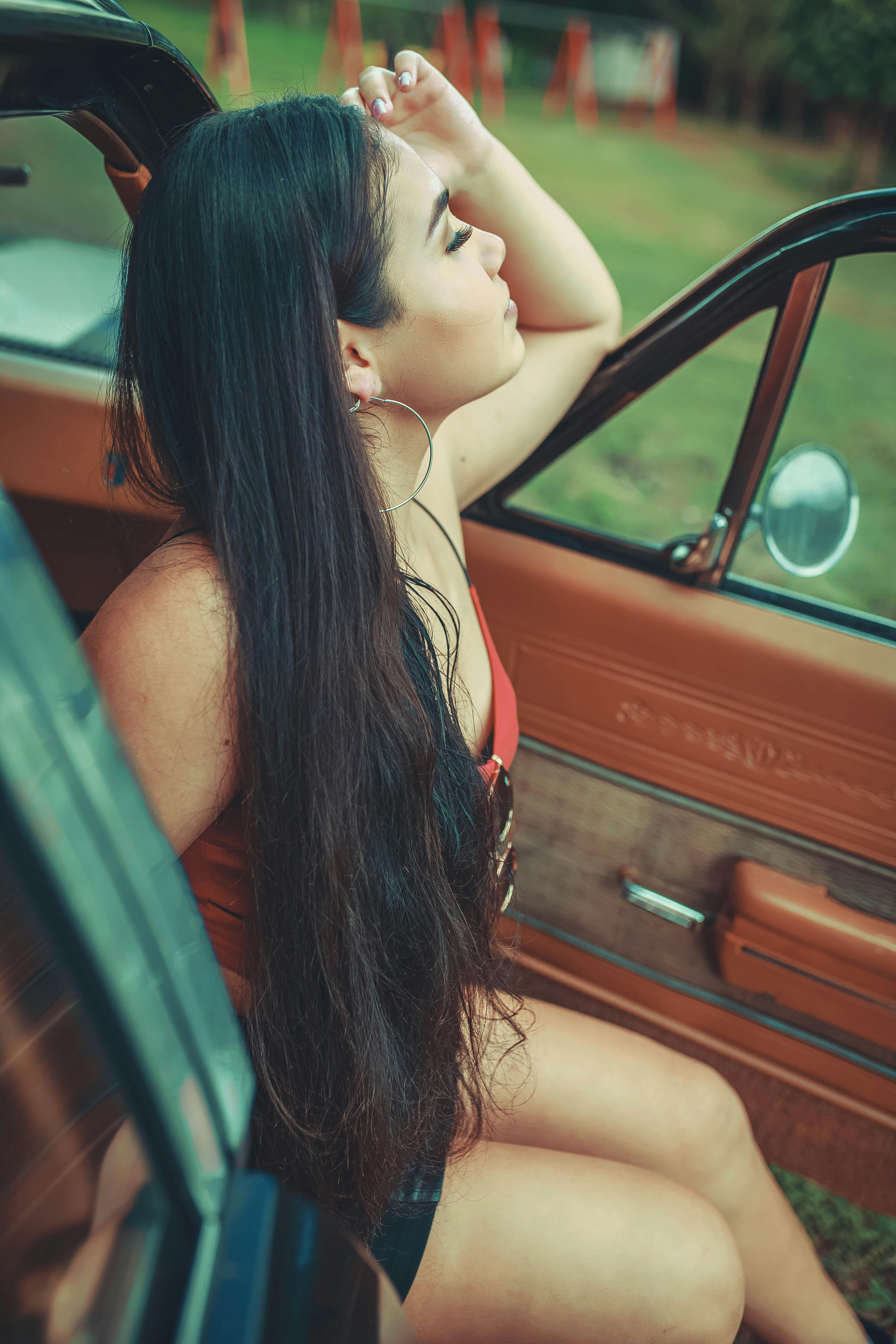 woman posing beside the car door