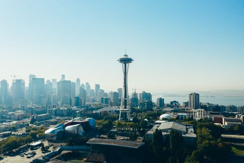 Free Aerial view of Seattle skyline featuring the iconic Space Needle under a clear sky. Stock Photo