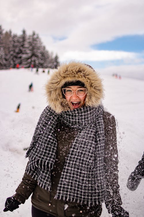 Free A Happy Woman Wearing Winter Coat Stock Photo