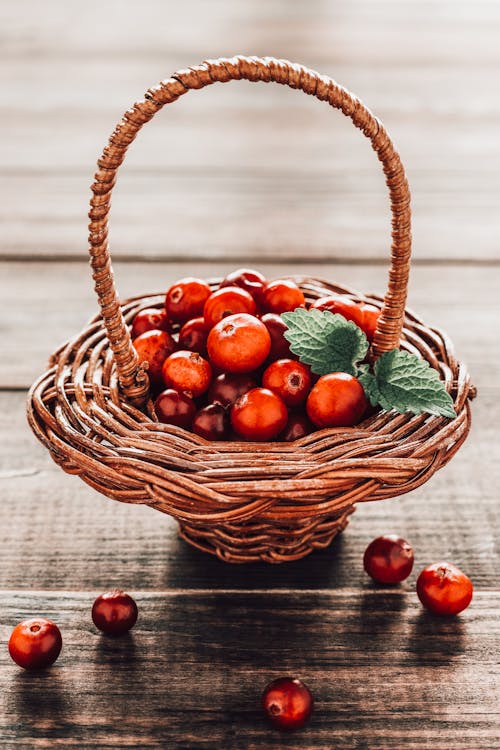 Red Round Fruits in Brown Woven Basket