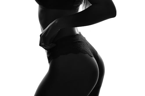 Free A Woman in Black Lace Panty Stock Photo