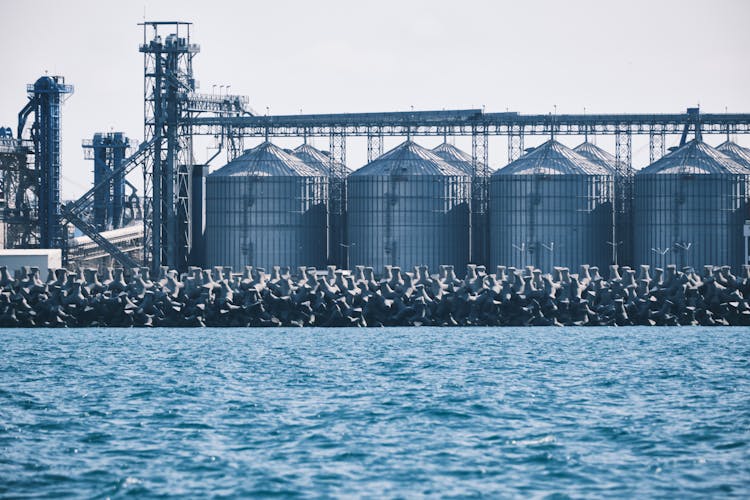 Steel Silos Near The Ocean