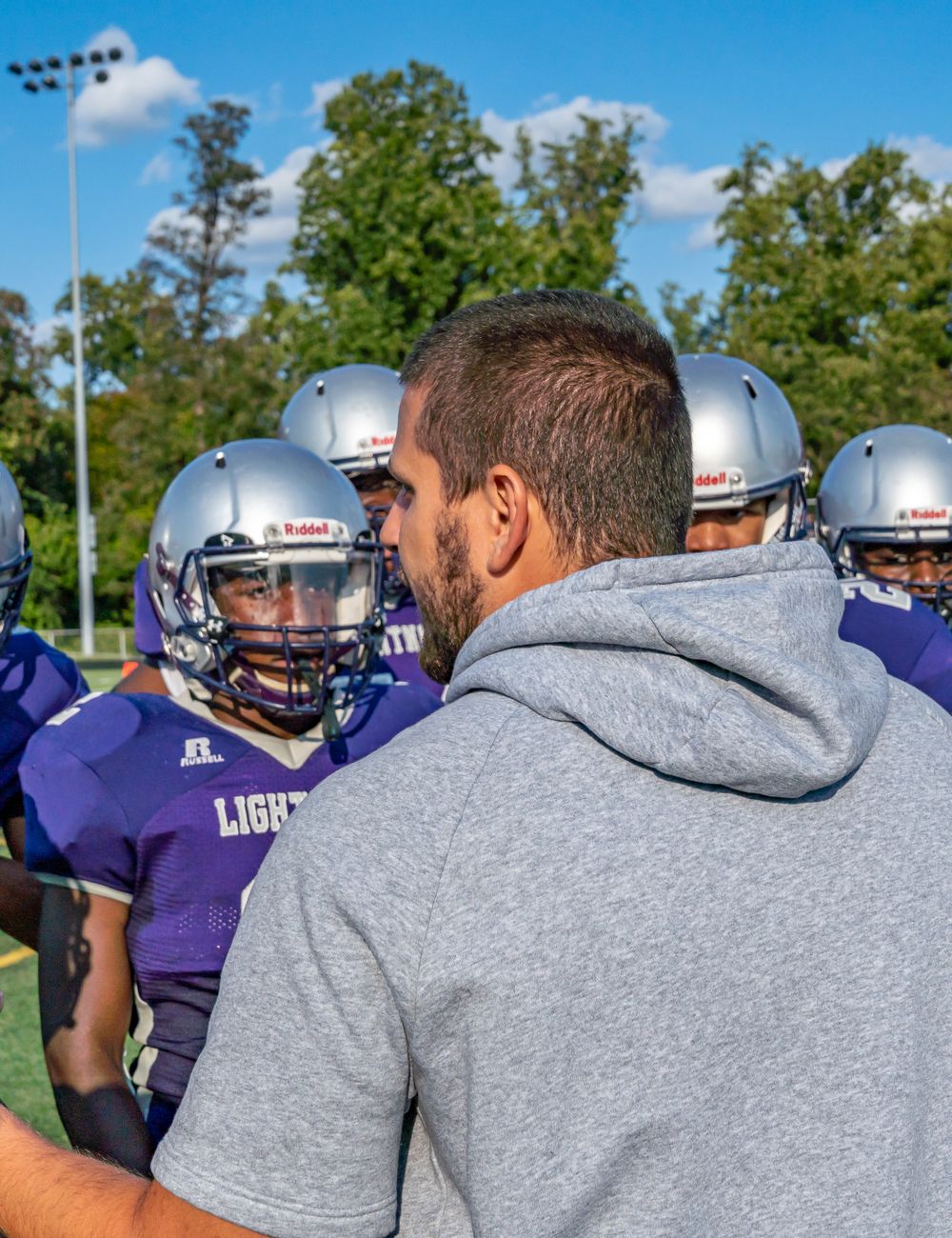Coach and team wearing the Purity Team Jacket