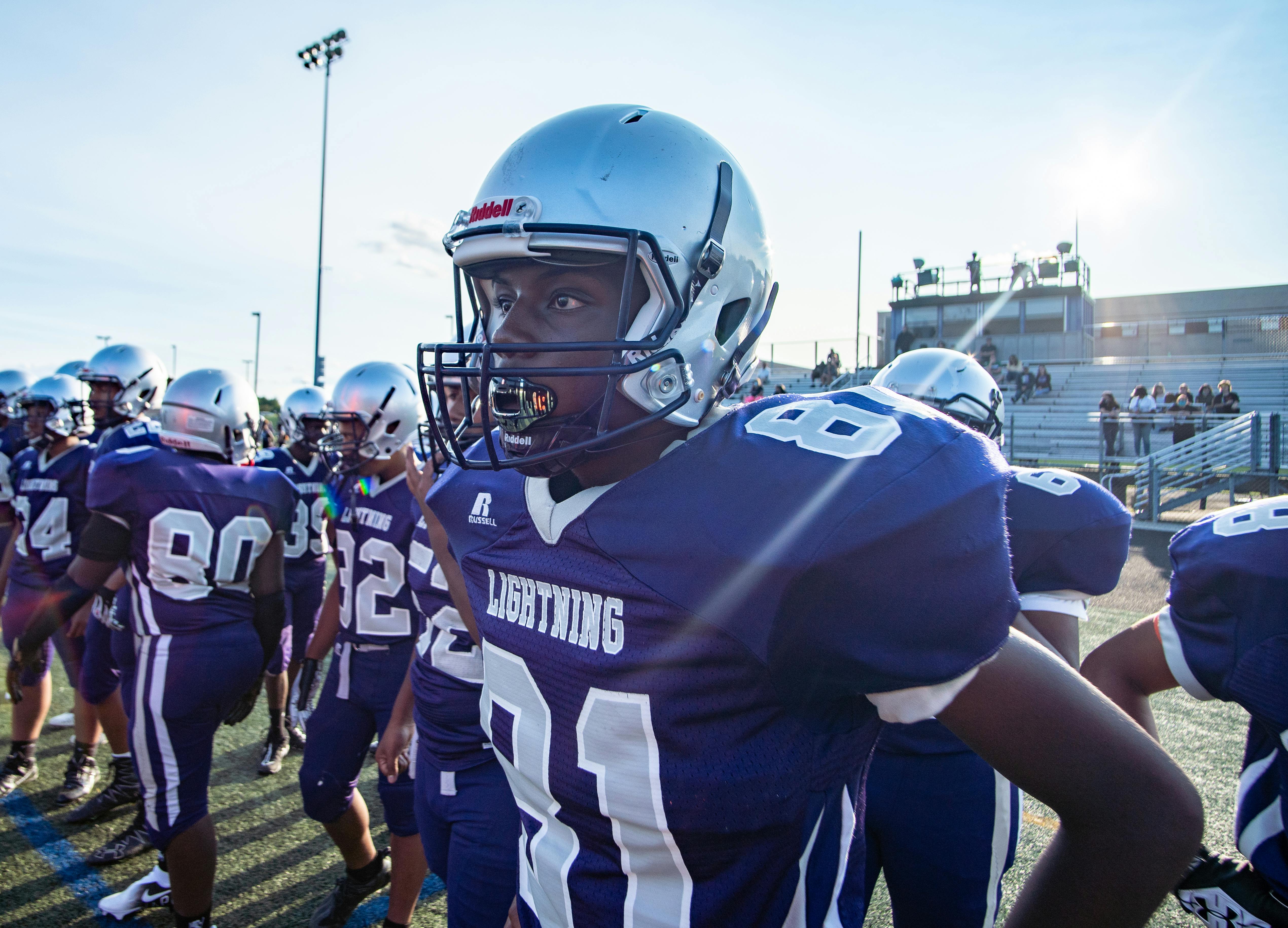 Multiple custom sports trading cards displaying different young athletes in various sports uniforms