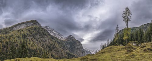 Landscape Photography of Mountains Under Gray Cloudy Sky