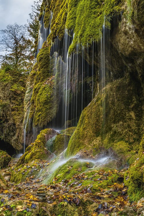 Free Waterfalls on Mountain Cliff Stock Photo