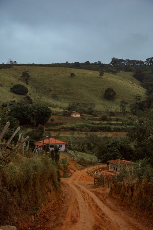 Free A scenic dirt road winds through the lush countryside in Andradas, Brazil. Stock Photo