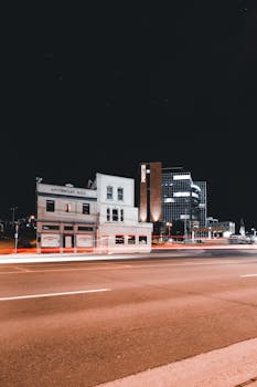 Captivating night view of urban buildings and street lights in a cityscape.