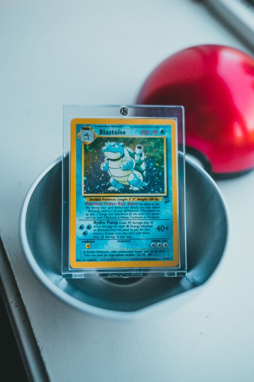 Vintage Pokemon cards displayed on a wooden surface showing the iconic appeal of classic trading cards