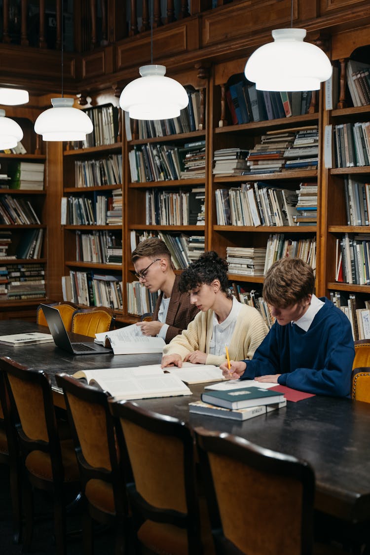 Students Sitting At The Table