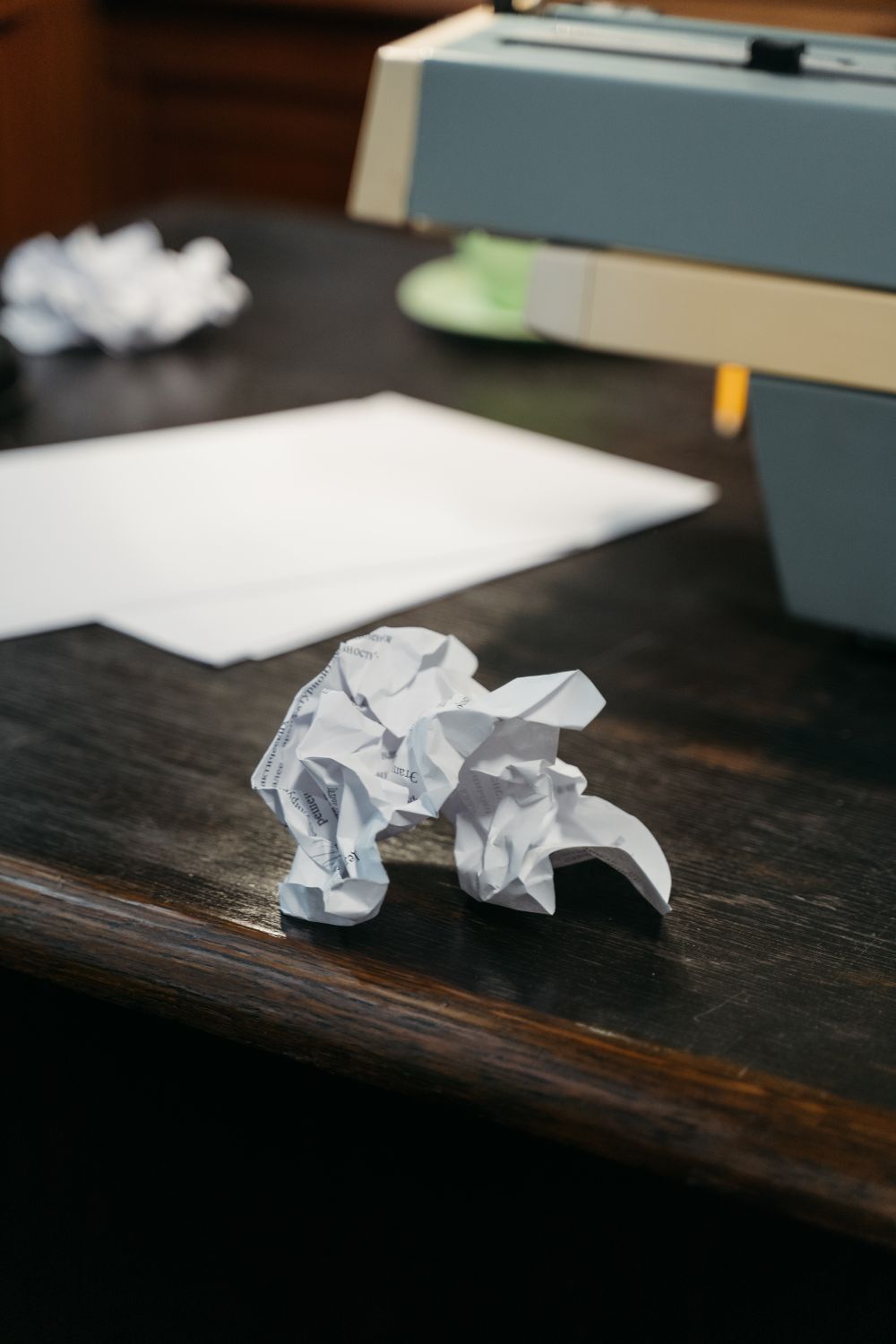 Printer with crumpled paper on a desk