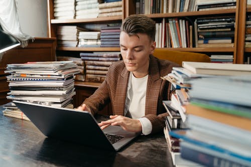 A Man using a Laptop