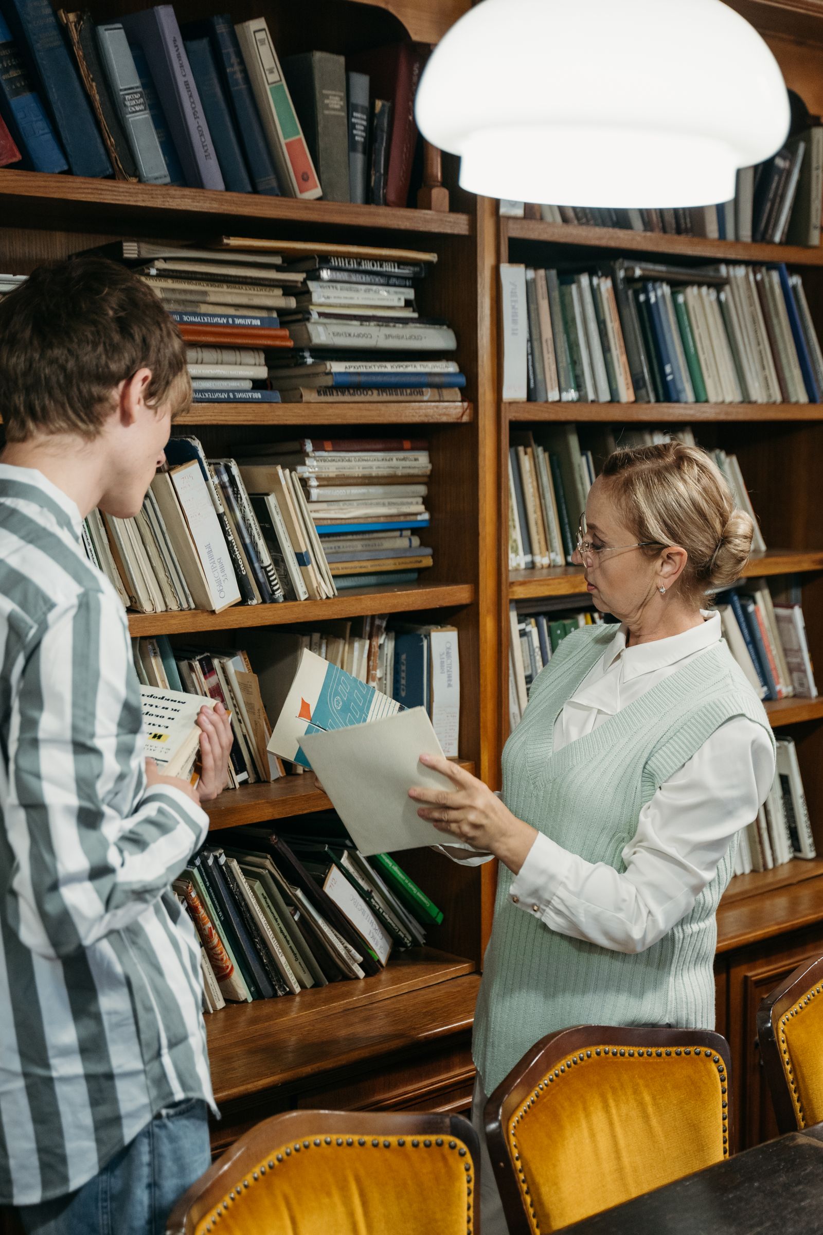 Librarian helping a reader