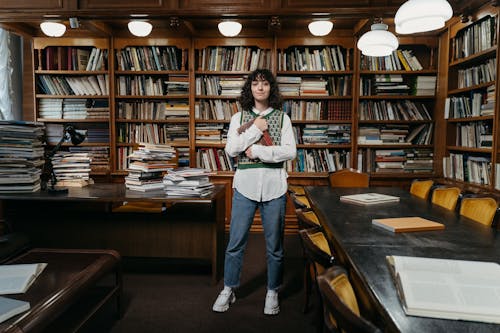Free Female College Student Standing Inside the Library Stock Photo