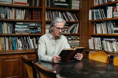 Elderly Man Reading a Book