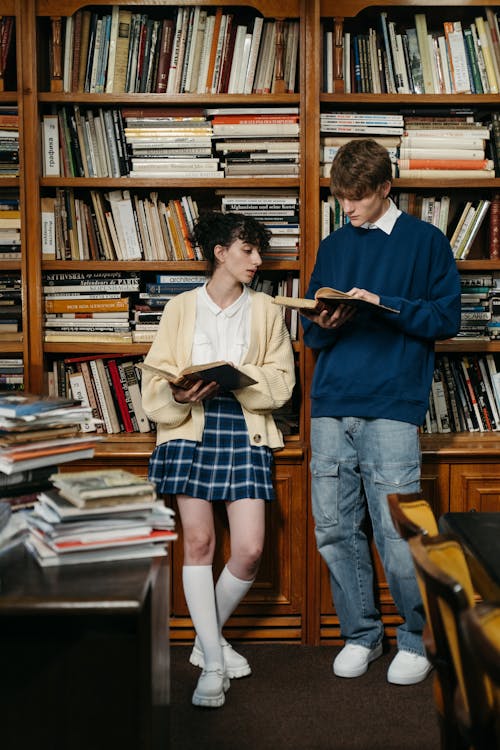 A Man and a Woman Reading Books Together